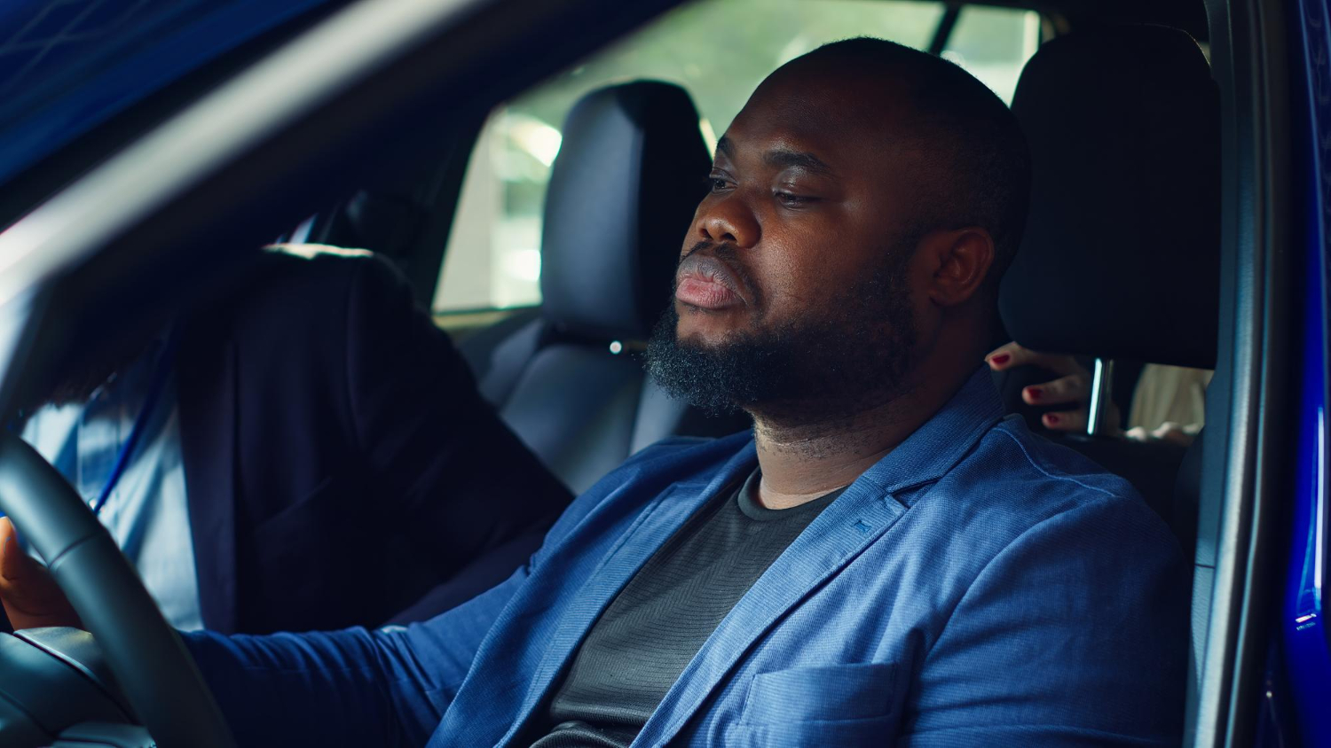 Focused driver at the wheel of a car
